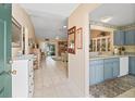 Inviting entryway featuring tile flooring, neutral paint, and a seamless transition to the living spaces at 17860 Se 89Th Natchez Ave, The Villages, FL 32162