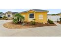 Charming home featuring a well-kept lawn, landscaping and walkway leading to the front door at 2101 Southern Star Way, The Villages, FL 32162