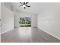 Bright living room with vaulted ceilings and sliding glass doors to the backyard at 2708 Lorraine Dr, Leesburg, FL 34748
