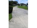 Long driveway leading to the house and garage at 31104 Fairvista Dr, Tavares, FL 32778