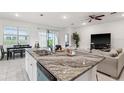 Open-concept kitchen featuring a spacious island with granite countertops and stainless steel appliances at 4701 Nw 51St Terrace Rd, Ocala, FL 34482