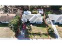 Home exterior showing full lot boundaries, nearby houses, and greenery at 1202 Deidrich Ct, Eustis, FL 32726
