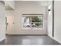 Bright living room featuring a large window and modern design elements, perfect for relaxation at 1603 Woodward St # 18, Orlando, FL 32803