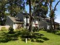 Charming two-story home featuring stone accents and lush landscaping at 2108 Dogwood Cir, Mount Dora, FL 32757