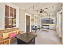 Relaxing front porch with string lights, seating, and an air hockey table at 501 Washington Ave, Eustis, FL 32726