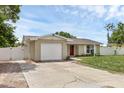 Charming single-story home with an attached one-car garage and fenced in yard at 1491 Providence Blvd, Deltona, FL 32725