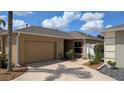Single story home with a one car garage and a well maintained yard at 1496 Lime Grove Ln, The Villages, FL 32162