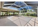 Covered lanai area with a hot tub, offering privacy and a relaxing outdoor living space at 1509 Trenton Ln, The Villages, FL 32162