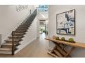 Hallway showing stairway with decor and a view of the great room at 16030 Vetta Dr, Bella Collina, FL 34756