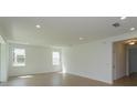 Spacious living room with tile floors and natural light at 2208 Keystone Pass Blvd, Minneola, FL 34715