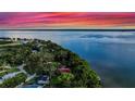Expansive lakefront property with lush greenery and stunning water views at 30523 Orange Dr, Leesburg, FL 34748