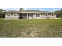 Single story home with screened porch and lovely, well-kept lawn at 37007 Forestdel Dr, Eustis, FL 32736