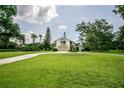 A spacious front yard leads up to this charming two-story home at 37138 Lake Yale Pl, Grand Island, FL 32735