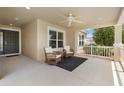 Inviting front porch with seating, perfect for relaxing and enjoying the neighborhood views at 5311 Eads Ter, The Villages, FL 32163