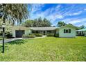 Charming single story home with lush green lawn and attached garage at 5319 Eagles Nest Rd, Fruitland Park, FL 34731