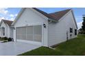 Charming home featuring a well-manicured lawn and a convenient two-car garage at 1105 San Remo Ln, Lady Lake, FL 32159