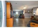 Open-concept living room and dining area featuring modern flooring and neutral paint at 11926 Milan Way, Leesburg, FL 34788