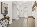 Stylish entryway featuring tiled floors, modern decor, and a well-lit, welcoming ambiance at 1620 6Th Ave, Deland, FL 32724