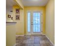 Bright foyer with neutral tile flooring and a view of the home's interior at 1675 Westminster Ct, The Villages, FL 32162
