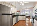 Spacious kitchen with stainless steel appliances, granite countertops, and ample cabinet space at 26034 Oakmount Dr, Leesburg, FL 34748
