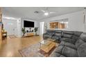 Bright living room with hardwood floors and a sectional sofa, perfect for entertaining at 2743 Nattie Ct, Orlando, FL 32826
