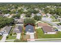 Aerial view of a lovely residential home with a defined property line in a green neighborhood at 2849 Doe Run Trl, Orange City, FL 32763