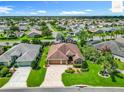 Beautiful aerial shot highlighting the home, its well-manicured lawn, and serene neighborhood at 2994 Adrienne Way, The Villages, FL 32163