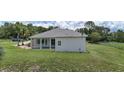 Back of the home featuring a screened-in porch, perfect for enjoying the outdoors in comfort at 32025 Timberlake Dr, Mount Dora, FL 32757