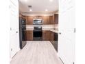 Well-equipped kitchen featuring stainless steel appliances and ample cabinet space at 8161 Cr 647, Bushnell, FL 33513