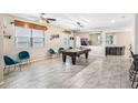 Entertaining game room with a billiard table, stylish seating, and ample space for hosting gatherings at 12120 Sumter Dr, Orlando, FL 32824