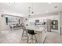 Bright and spacious kitchen featuring stainless steel appliances, a large island, and a connected dining area at 12120 Sumter Dr, Orlando, FL 32824