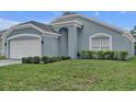 Close up of a charming single-story home featuring manicured shrubbery at 1808 Westpointe Cir, Orlando, FL 32835
