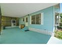 Wide angle of the covered and screened-in carport, featuring easy access to the home at 32339 Oak Park Dr, Leesburg, FL 34748