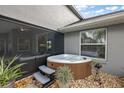 Relaxing hot tub nestled in a private pebble-covered space, perfect for unwinding after a long day at 5412 County Road 125, Wildwood, FL 34785