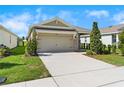 Inviting single-Gathering home boasting a neat lawn and a convenient two-car garage at 8128 Penrose Pl, Wildwood, FL 34785