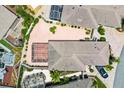 Aerial view showcases the home's patio, screened-in pool, and landscaped yard, providing an overview of the property at 3105 Carrollton Ct, The Villages, FL 32162