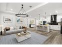Inviting living room featuring modern furnishings, an open layout, and seamless transition to the kitchen area at 321 Watershore Dr, Leesburg, FL 34748
