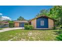 Lovely single-story brick house showing trimmed shrubbery and a well-maintained lawn at 35338 Lake Unity Rd, Fruitland Park, FL 34731