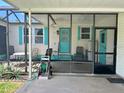 Inviting screened-in porch area provides extra living space and is ideal for relaxing and entertaining at 902 Rose Ln, Lady Lake, FL 32159