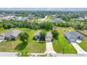 Single-story home nestled within a vibrant community and surrounded by mature trees at 10331 Sw 45Th Ave, Ocala, FL 34476