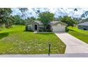 Inviting single-story home features a lush green lawn and well-maintained landscaping at 10331 Sw 45Th Ave, Ocala, FL 34476