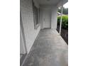 Covered front porch with white brick detail at 11532 Beaman Cir, Clermont, FL 34711