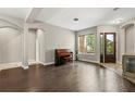 Open-concept living room with hardwood floors and natural light at 1444 Whitney Isles Dr, Windermere, FL 34786
