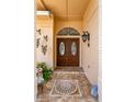 Inviting double front doors with decorative glass details, set against a tiled entryway with decorative ornaments at 3309 Paisley Cir, Orlando, FL 32817