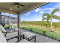 Relaxing screened patio with comfortable seating and a picturesque view of the lush backyard at 3467 Buoy Cir, Winter Garden, FL 34787