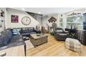 Spacious living room with comfortable seating, a large window, and modern accents at 4207 Bair Ave, Fruitland Park, FL 34731