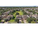 Scenic aerial view of a quiet residential neighborhood with mature trees and well-maintained lawns at 621 Lost Grove Cir, Winter Garden, FL 34787