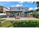Spacious backyard featuring a patio, fire pit, and outdoor seating areas for relaxation and entertainment at 621 Lost Grove Cir, Winter Garden, FL 34787