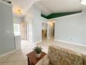 Open-concept living area with bright paint, tile flooring, and versatile layout at 15349 Lafite Ln, Clermont, FL 34714