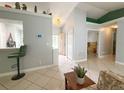 Living area showcasing the tile flooring, open layout, and neutral color palette at 15349 Lafite Ln, Clermont, FL 34714